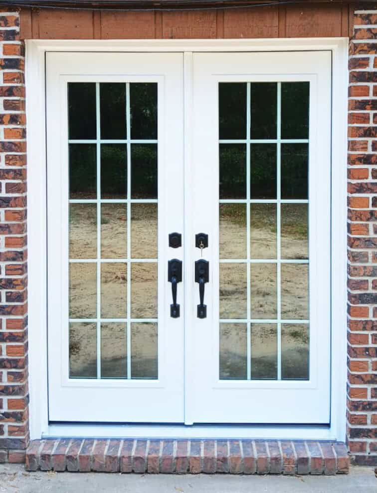 2d811043-8d69-44e5-946b-be762aa3916d new french patio doors in brick home