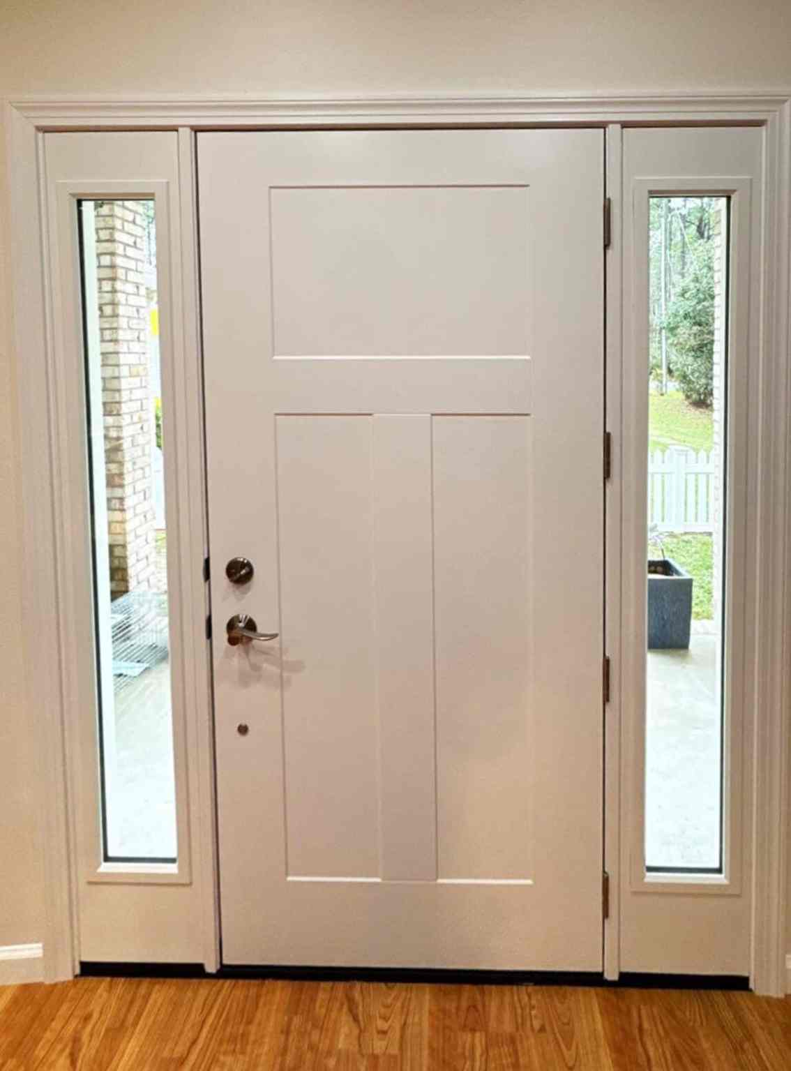 456934bd-a77b-4df7-bfd6-7dd5ec62a977 home interior with new white entry door