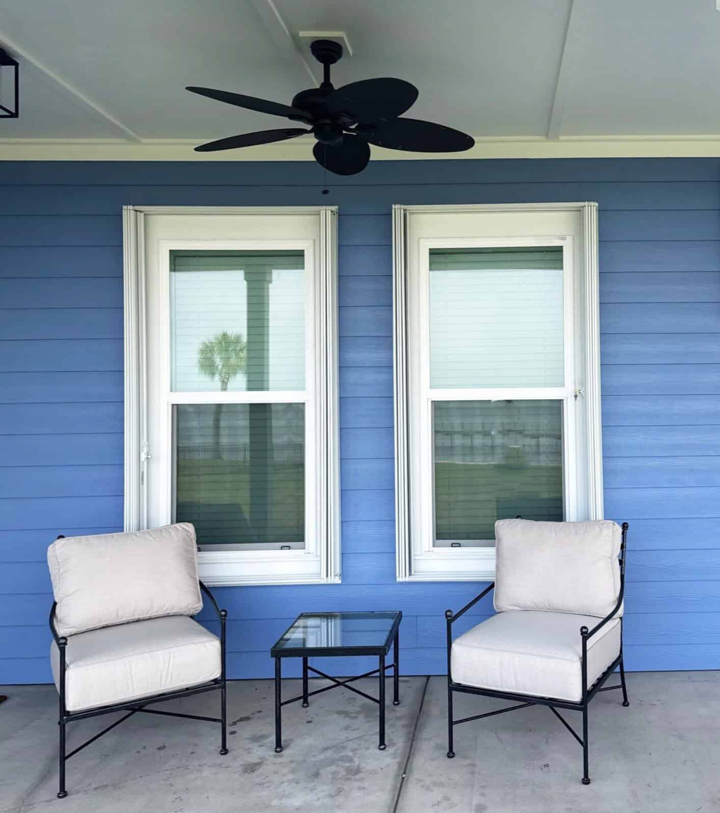 blue home exterior with two double hung windows