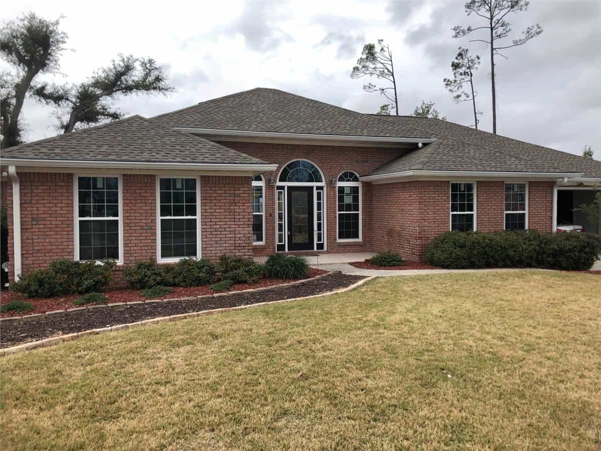 Impact Windows 4 red brick home with impact and picture windows