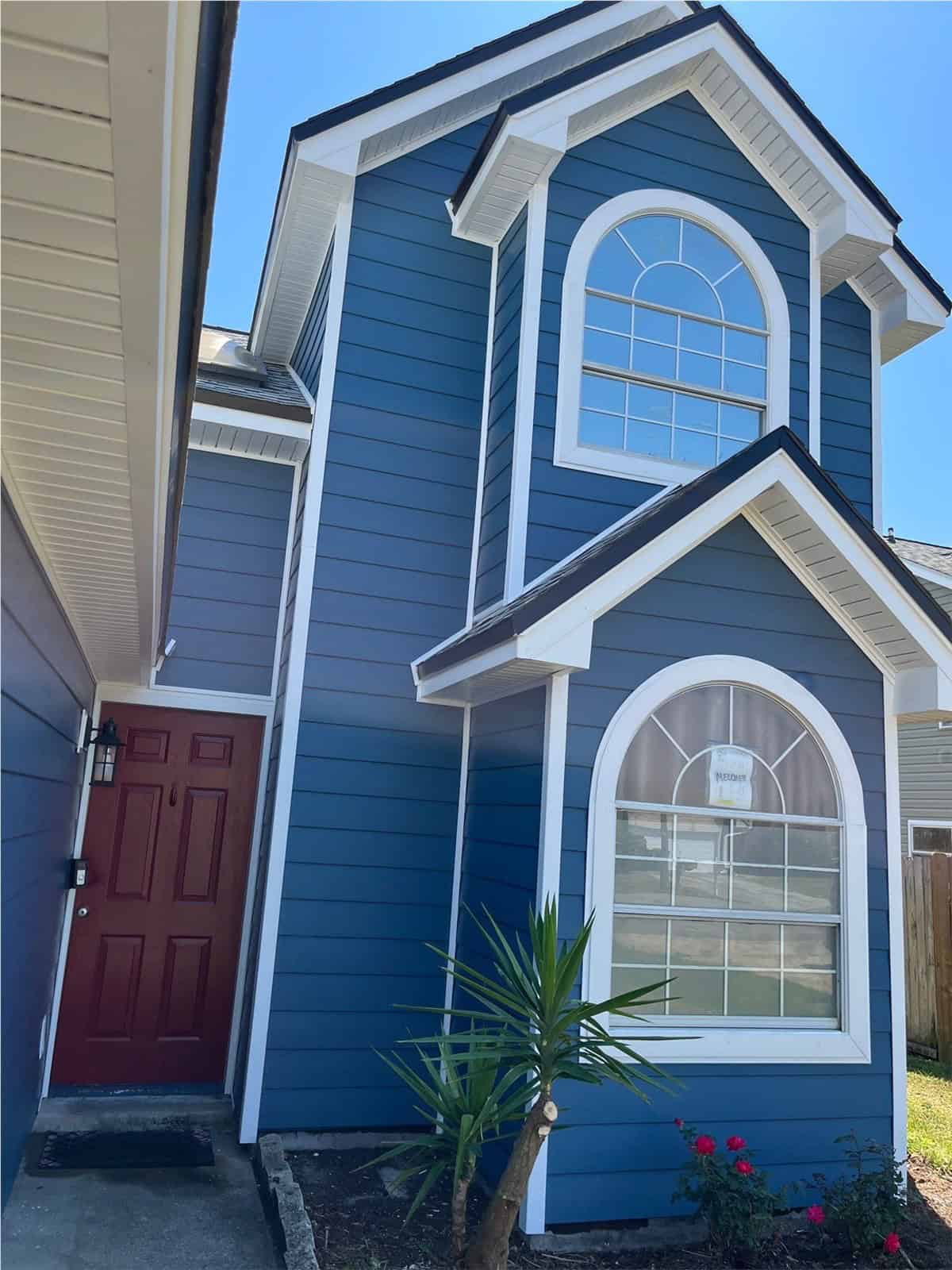 home with dark blue horizontal siding