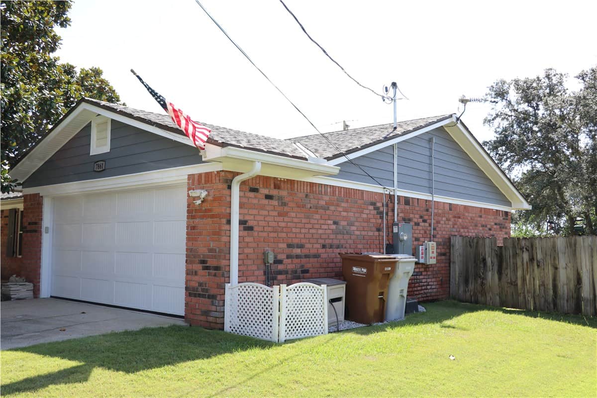 siding16 red brick home with upper composite siding