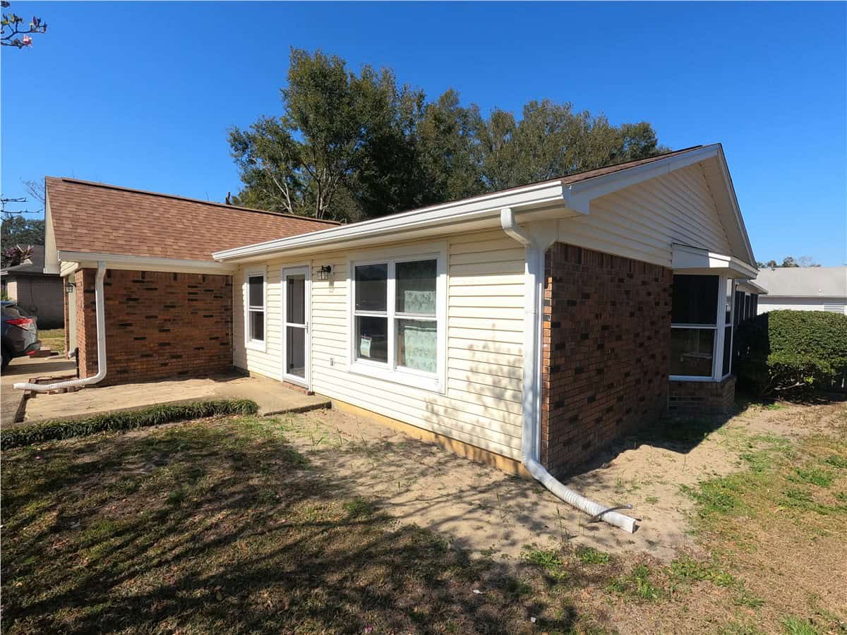 siding18 red brick with tan siding home
