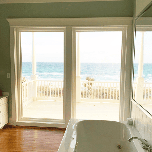 sliding patio door opening onto beach veranda
