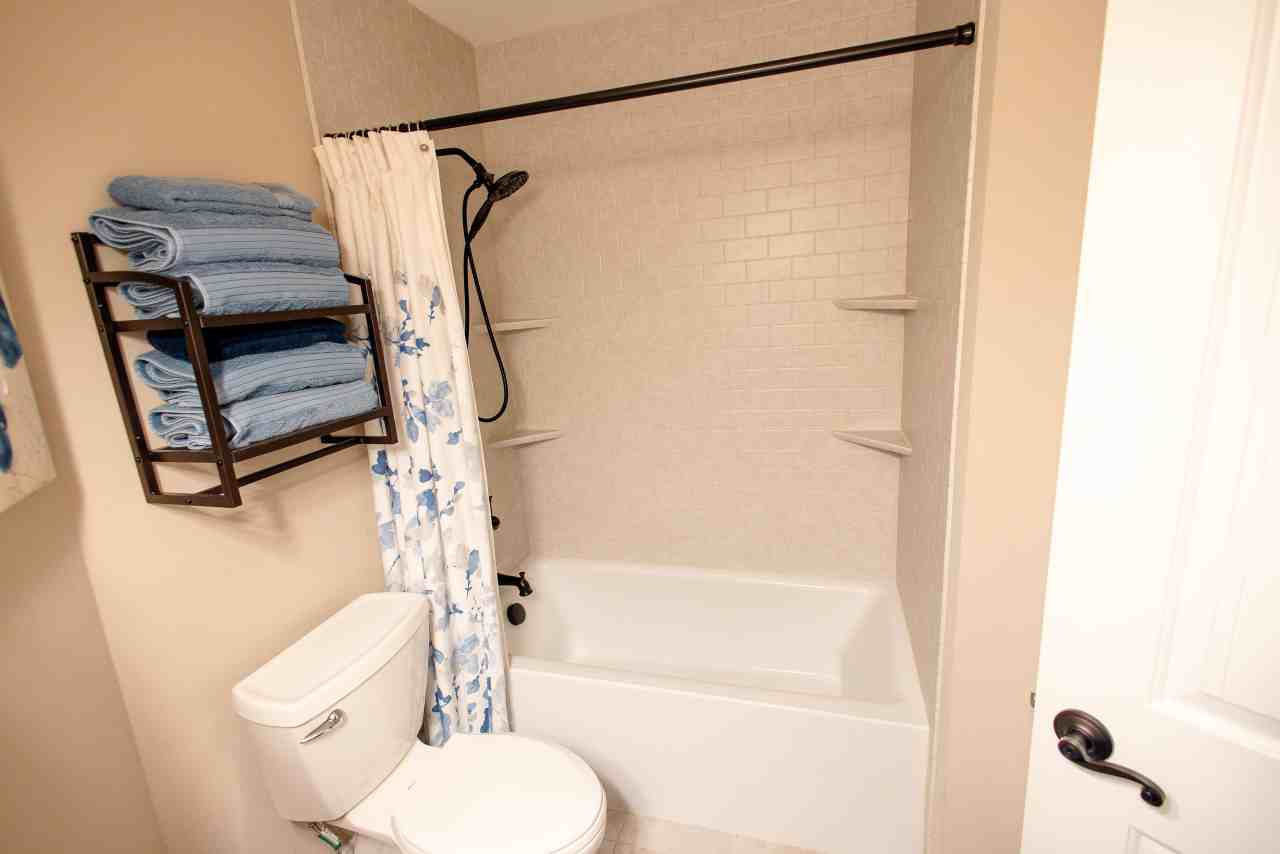 LatashaCarrawayPhotography-5377 tub shower combo with tile surrounds