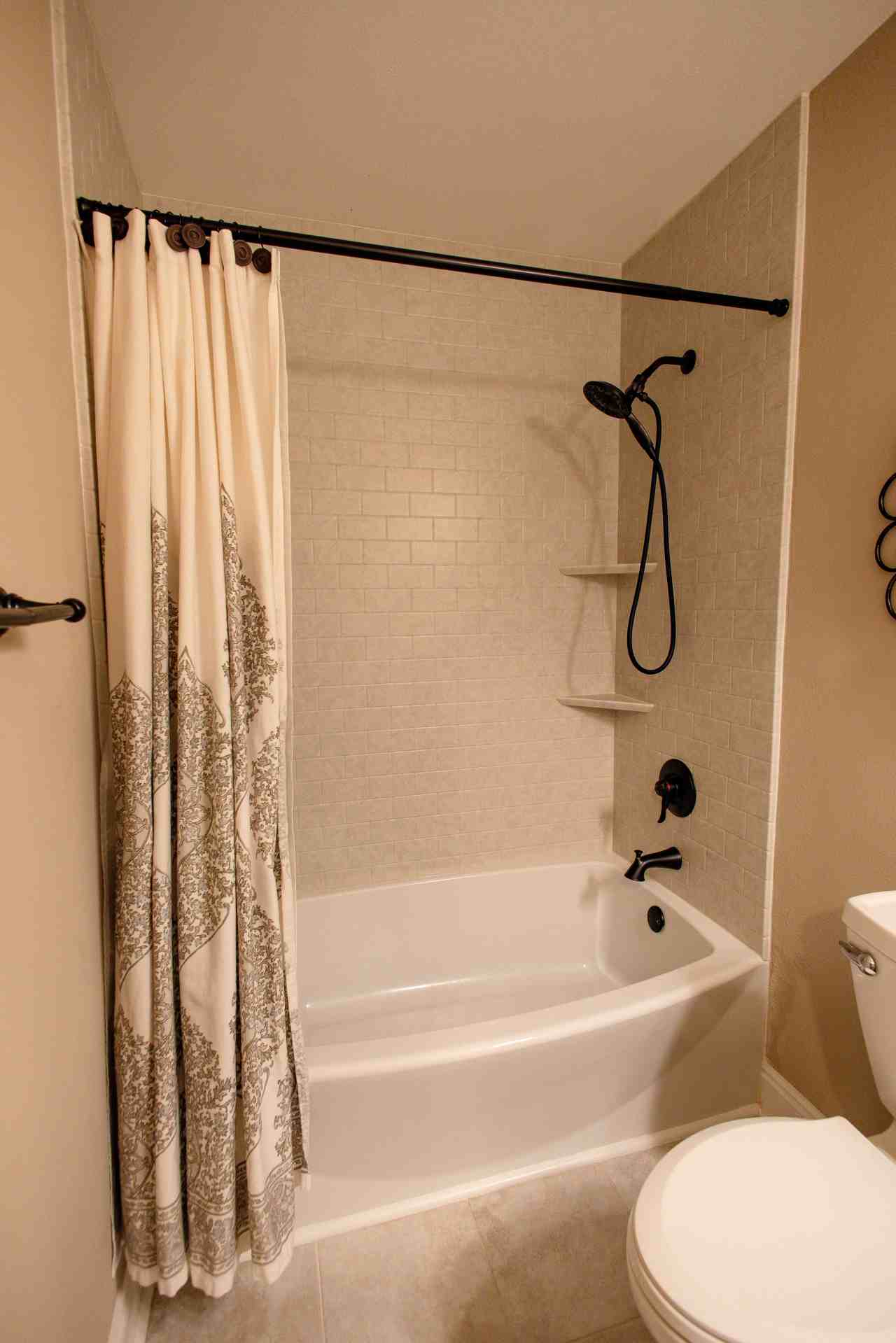 LatashaCarrawayPhotography-5395 shower and bathtub with tile-like wall surrounds and custom additions