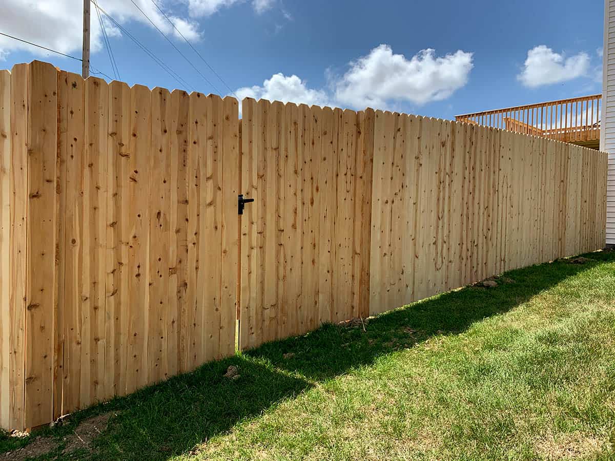 Natural wood privacy fence installation in NWFL for enhanced outdoor living and home value. Expert fence replacement and yard upgrades by HTC Pros, your trusted local home improvement company.
