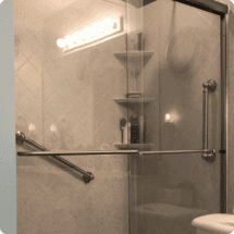 Window and door replacement in a modern shower enclosure, showcasing sleek fixtures and glass doors.
