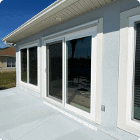 Modern sliding glass doors installation showcasing energy-efficient windows for home improvement in NWFL.