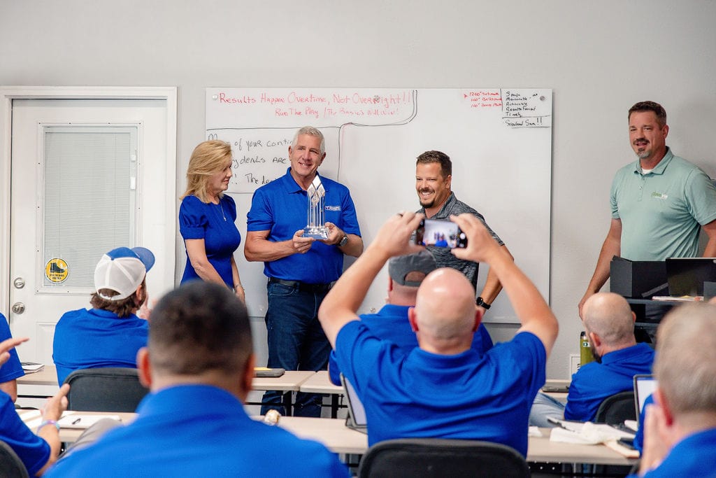 Hometown Contractors founders accept ProVia Platinum Plus 2025 Award
