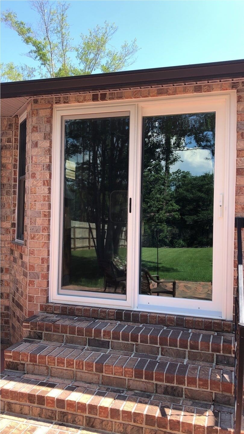 Sliding Patio Doors 3 Home patio showcasing newly installed sliding glass patio doors, installed by trusted home improvement experts Hometown Contractors, Inc.