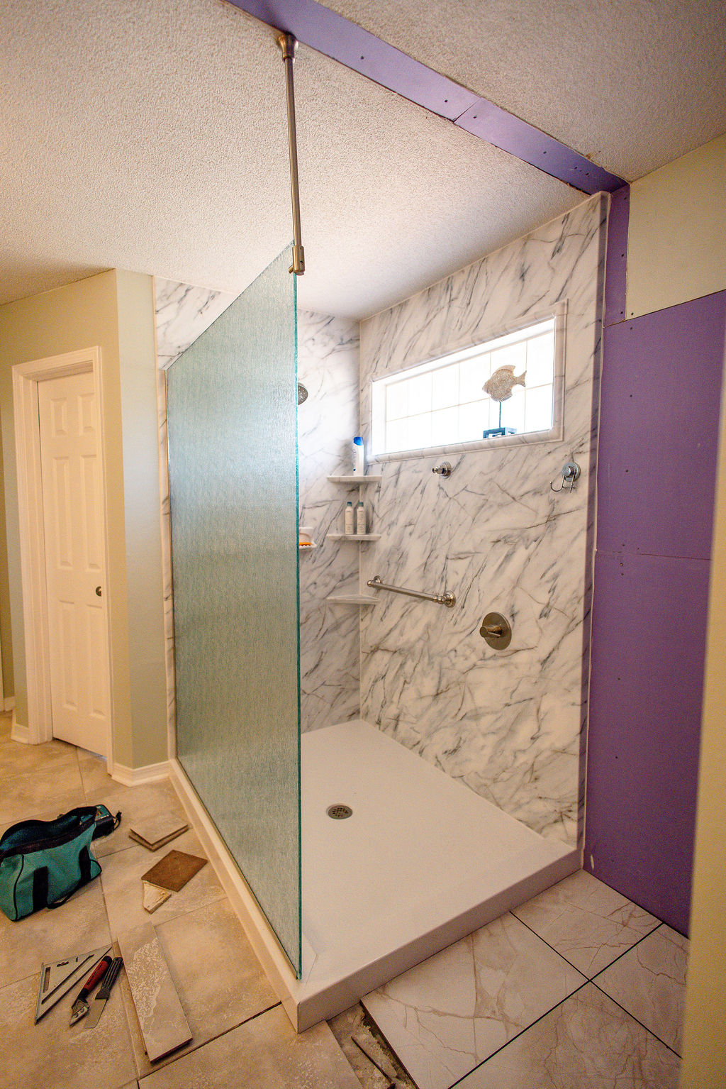 LatashaCarrawayPhotographyOrrell-8011 walk-in shower with grab bars and corner shelving