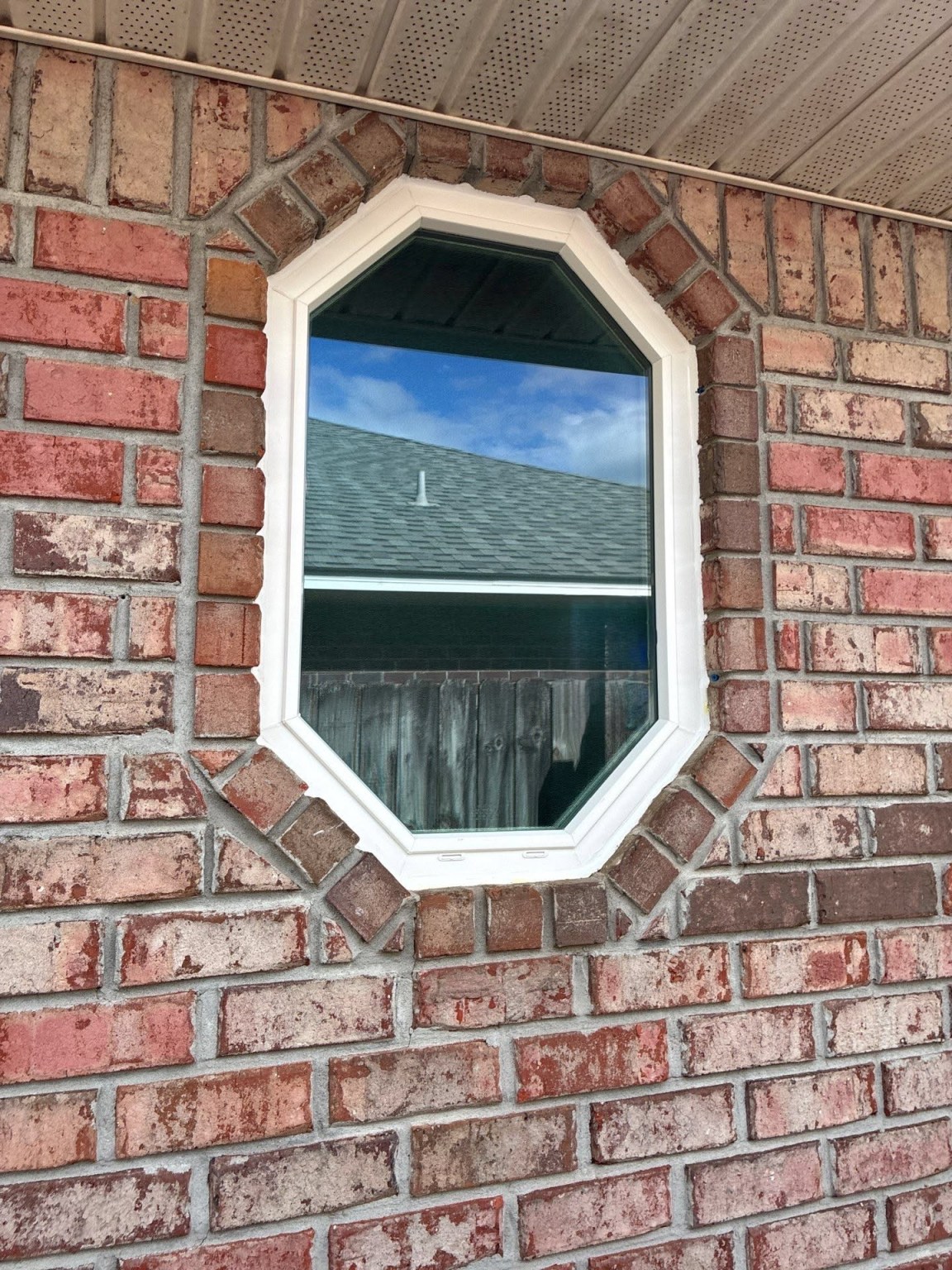 Gallery Specialty Window oblong octagonal window in red brick home