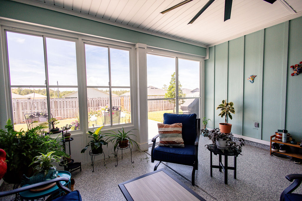 LatashaCarrawayPhotography.-3714 porch enclosure project interior showcasing 6 feet tall glass panels