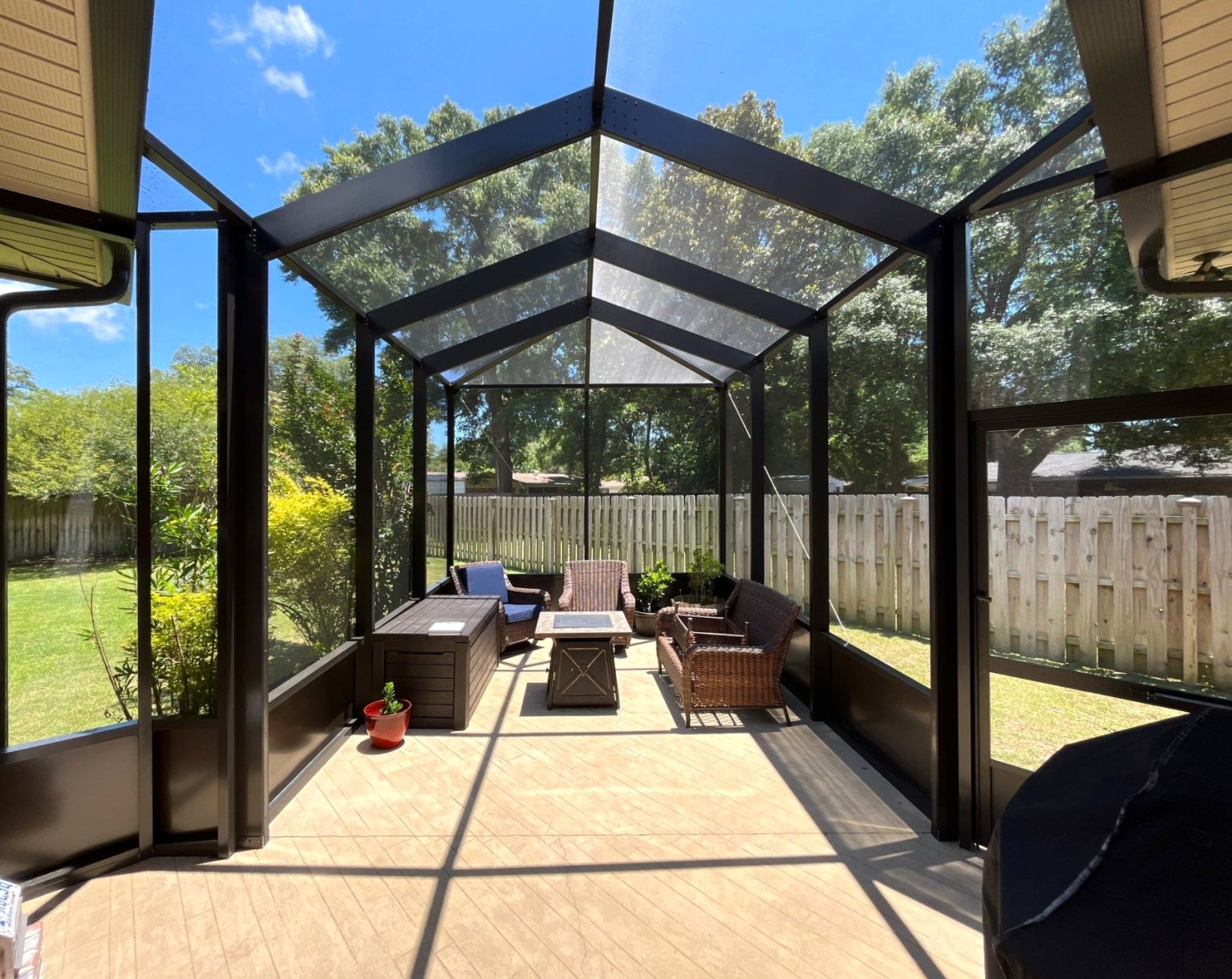 Gallery Screen Room Porch Narrow gabled screen room from the inside with lounge chairs surrounding a coffee table