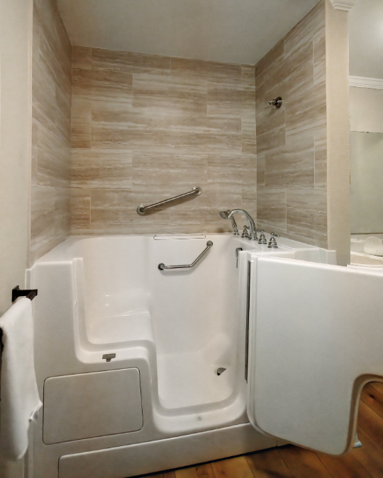 White walk-in tub with door swung open