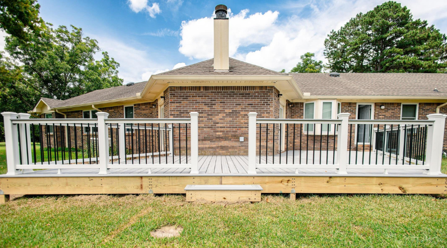 Decks - SAP - All Product Image Row Red brick home with newly installed viwinco double-hung windows.