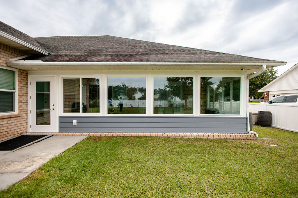 LatashaCarrawayPhotographyH.-9053 porch enclosure installed by Hometown Contractors in July 2026