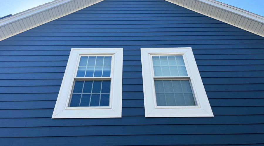 SAP - Siding Image Row - 1 Red brick home with newly installed viwinco double-hung windows.