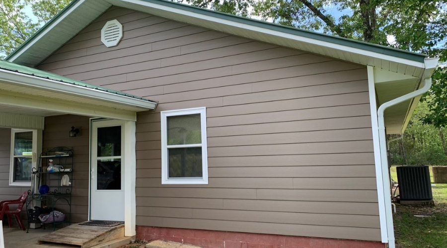 SAP - Siding Image Row - 4 Red brick home with newly installed viwinco double-hung windows.