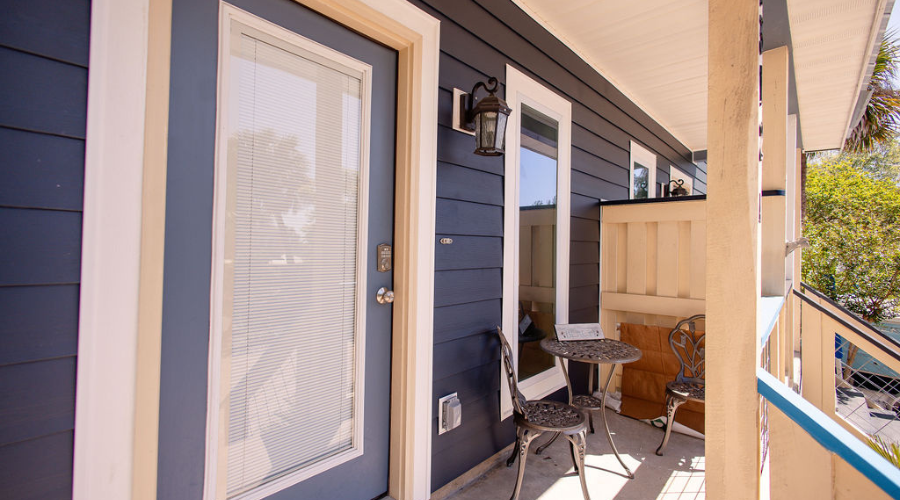 Siding - SAP - All Product Image Row Red brick home with newly installed viwinco double-hung windows.
