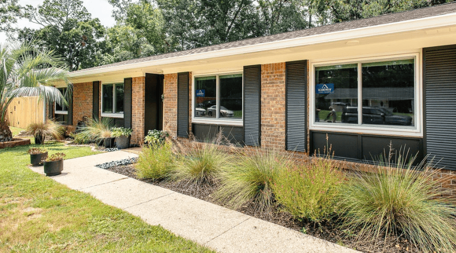 Window Replacement - Spotlight Posts (1) Red brick home with newly installed viwinco double-hung windows.
